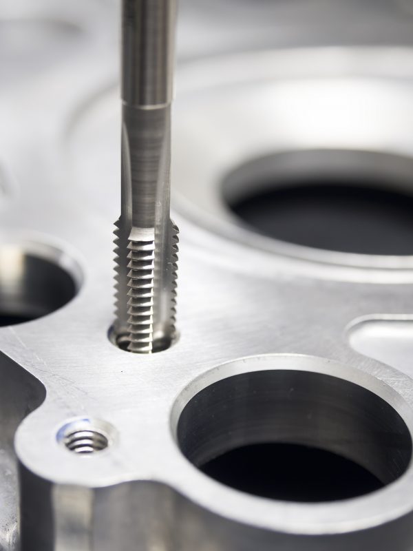 operator machining automotive parts by high precision machining center